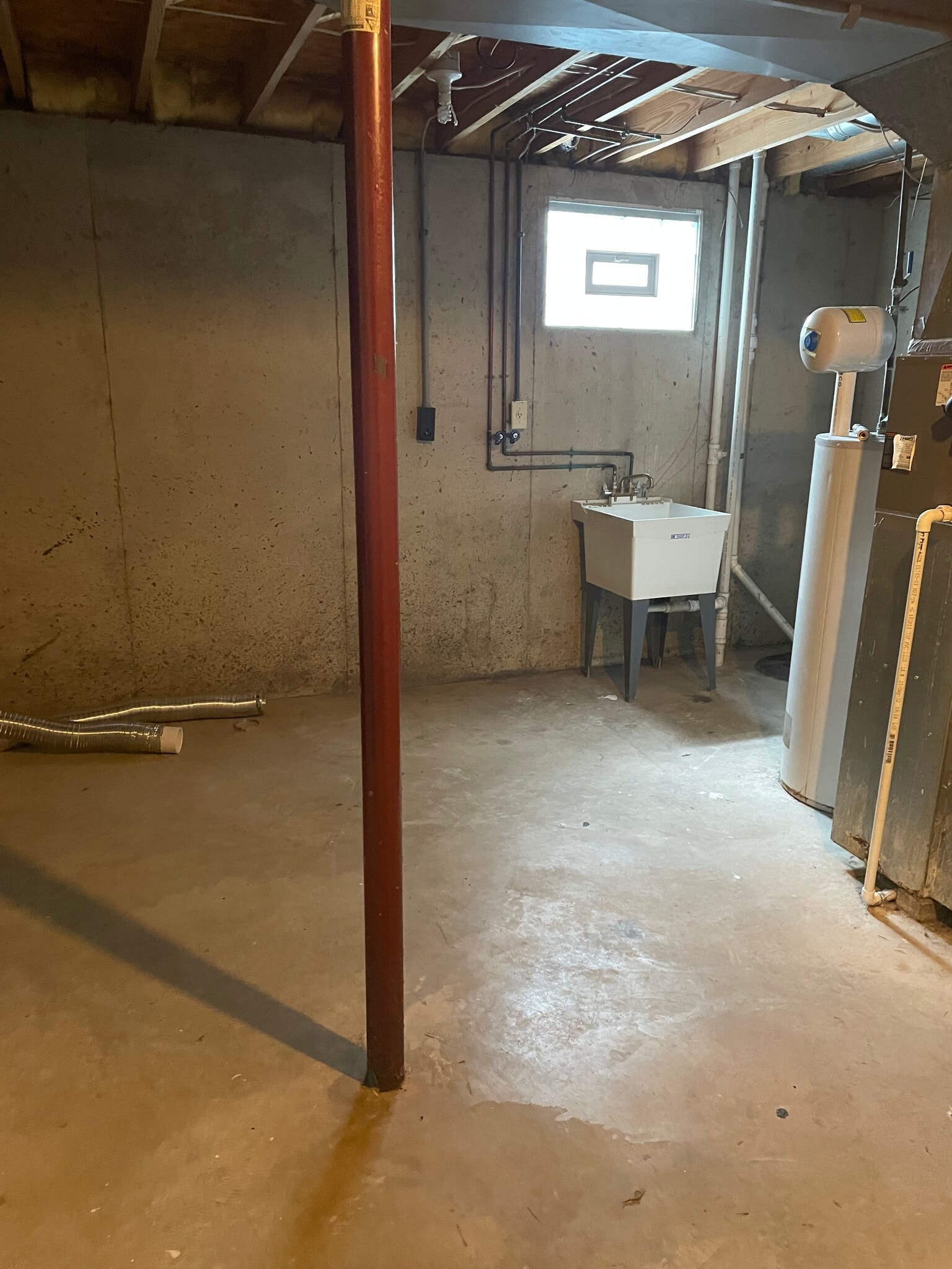 Washer/dryer hookups in basement with utility tub - 7960 Bobtail Ct