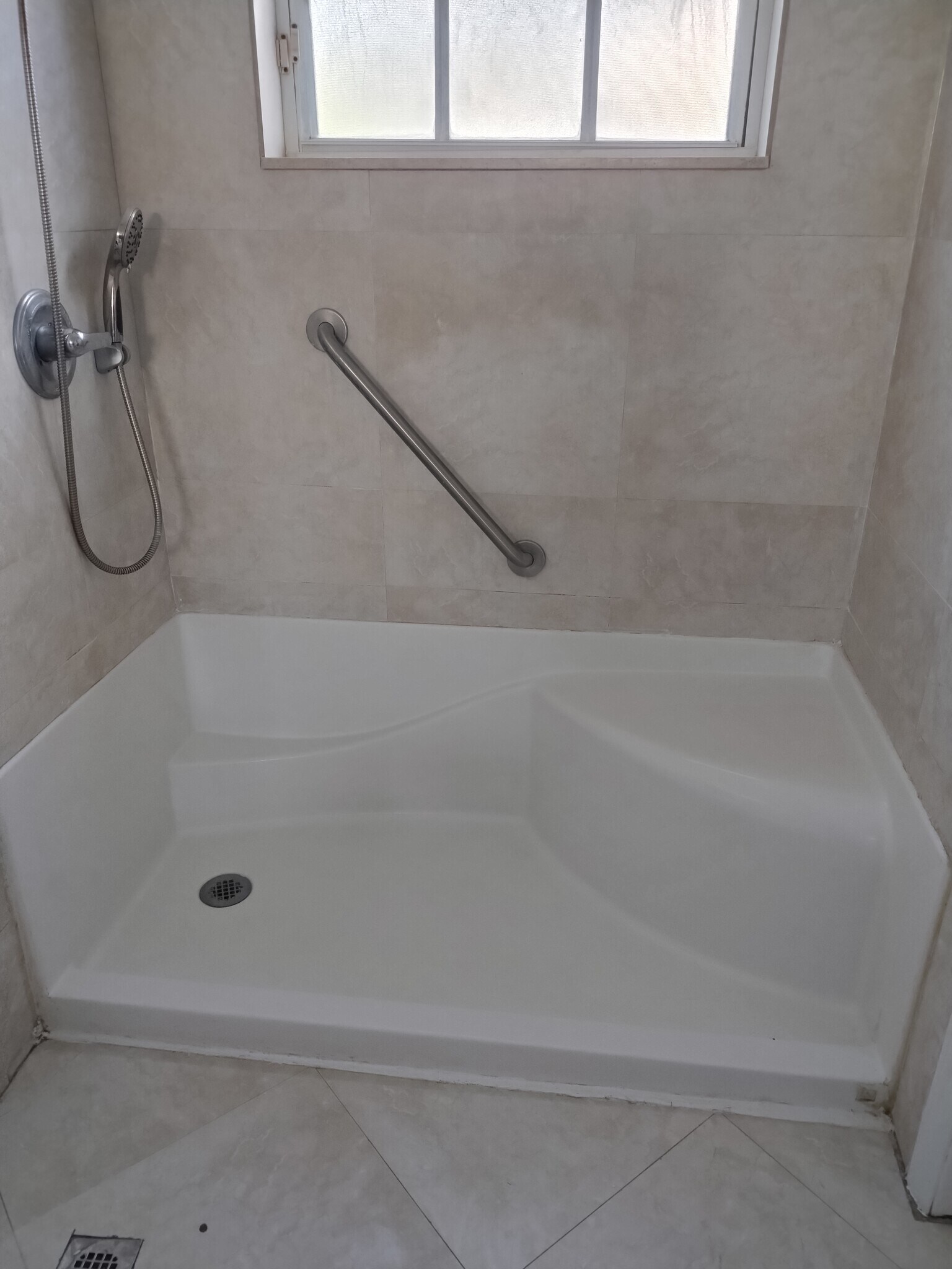 Walk in shower with safety rail and seating - 6999 W 25th Ave