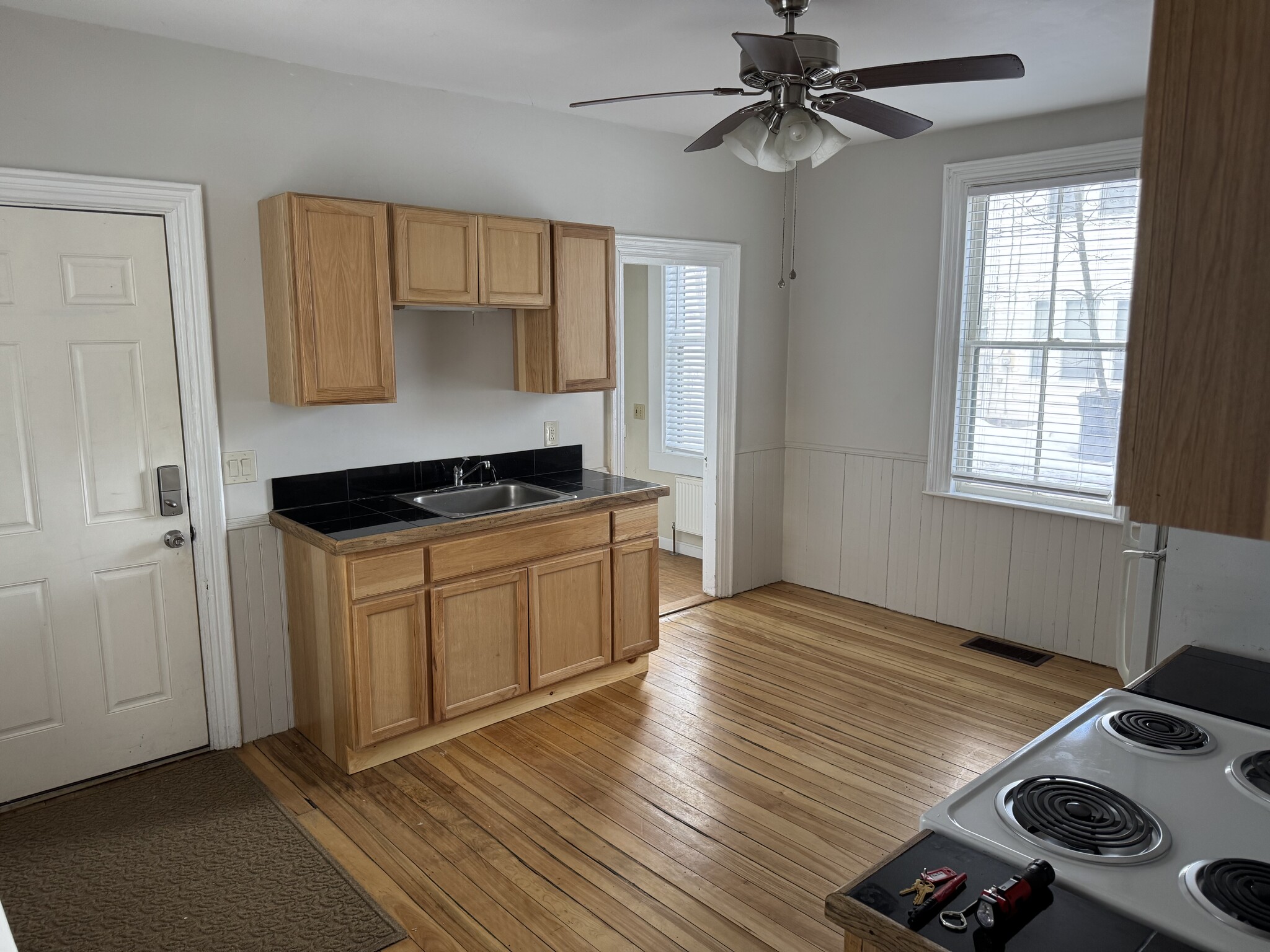 Kitchen showing sink and eat in area under window - 34 Elm St