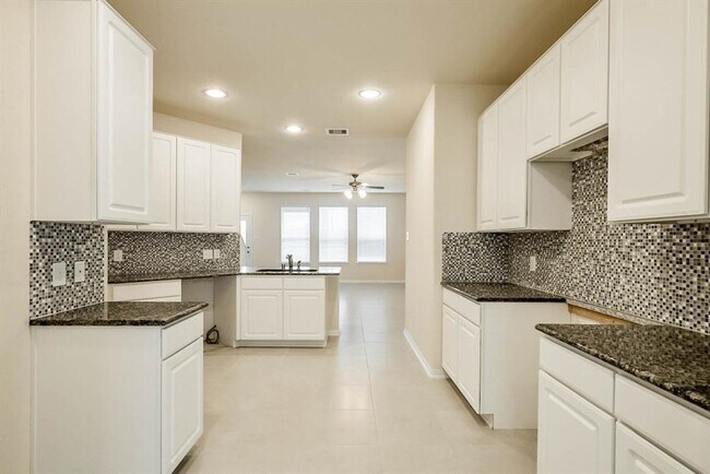 Building Photo - Beautiful stone front 4 bedroom, 3 bath home has bay windows in breakfast nook & master. It is on...