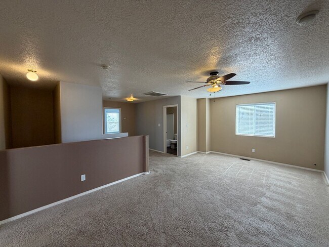 Building Photo - 4 Bedroom Home Available Near McMahon Blvd NW & Universe Blvd NW!