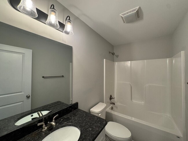 Building Photo - 1st Months Rent Free - Sunburst Villa Luxury Townhouse