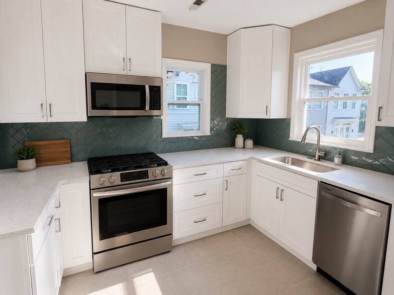 Fully renovated kitchen featuring new GE Appliances, quartz countertops - 51 Screven St NE