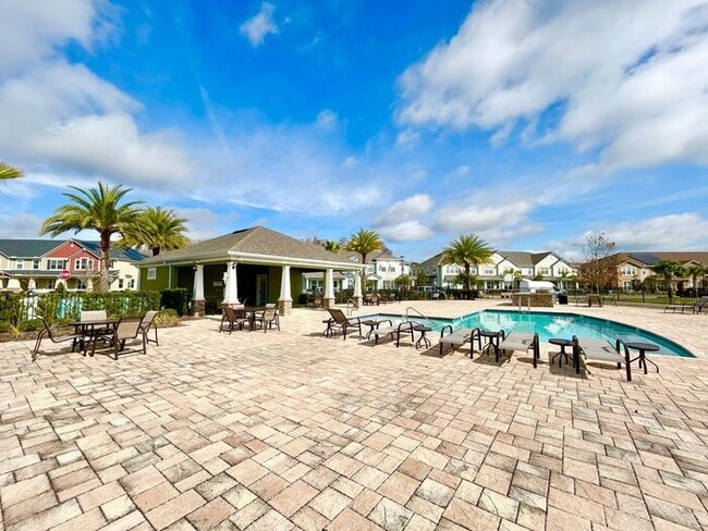 Building Photo - Luxurious 3/2.5 Modern Townhome with a Private Balcony and a 2 Car Garage in the Exclusive Gated ...