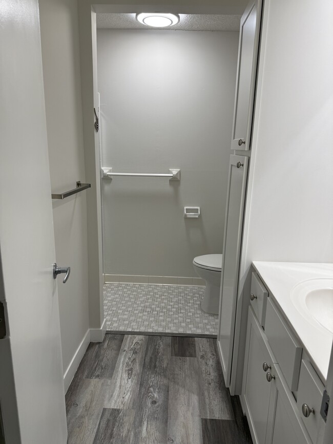 attached bath to primary bedroom with walk in shower - 7510 Cahill Rd