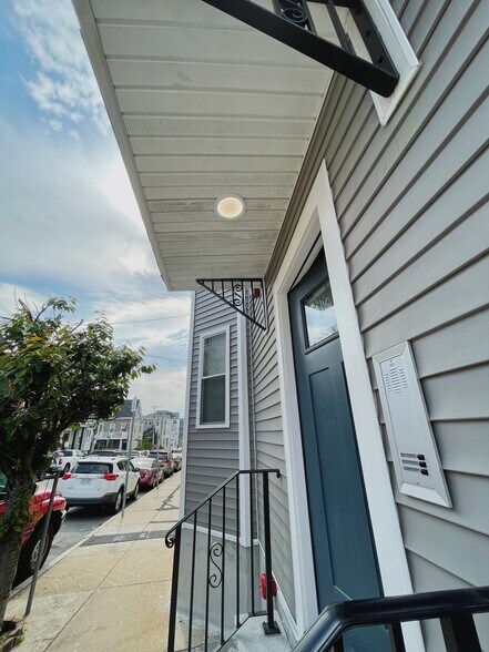 Building: Entryway; front-door leading to mailboxes and private-entry secure doors for units one and - 34 Falcon St