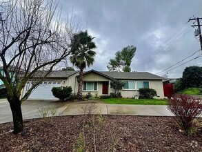 Building Photo - beautifully updated home offers a spacious...