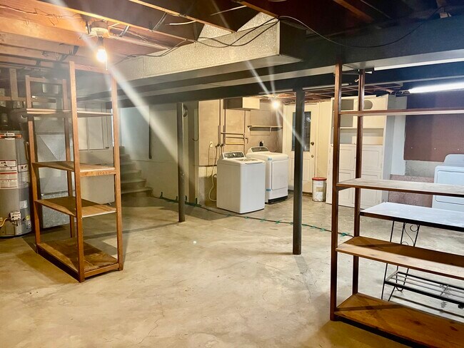 Basement has tons of storage! And walkout/walkup access to built in shed under deck - 318 NW Woodland Rd