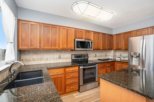 Building Photo - Spacious 4-Bedroom Home in District 20 with Huge Deck & Fenced Yard