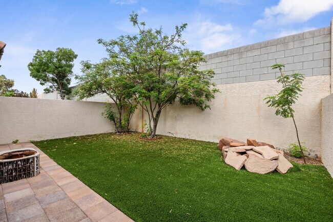 Building Photo - Charming and spacious single-story townhome nestled within a gated community in the desirable Nor...