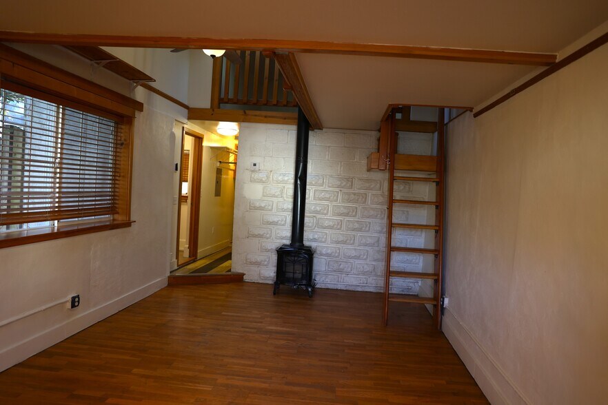 Living Room with Captain's Ladder - 1833 NE 52nd Ave