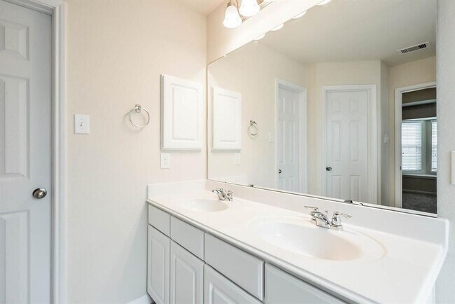 Building Photo - Beautiful stone front 4 bedroom, 3 bath home has bay windows in breakfast nook & master. It is on...