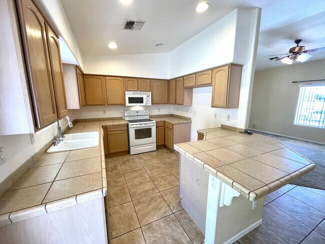 Building Photo - Inviting 3 Bedroom Home with RV Parking an...