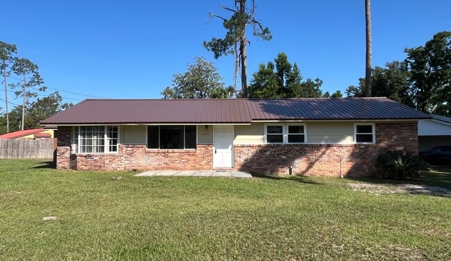 Primary Photo - Charming 4-Bedroom Brick Home on Spacious ...