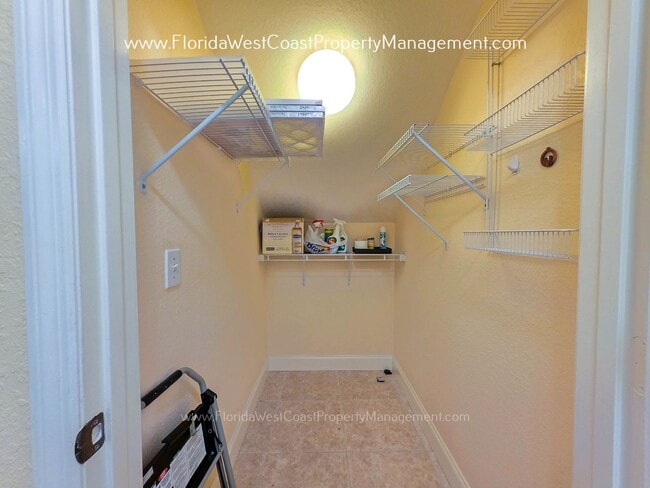 Building Photo - MOVE IN READY! LARGE 2 BEDROOM/2 BATH PLUS ATTACHED GARAGE! TILE/LVP THROUGHOUT!