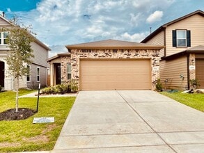 Building Photo - Willow Wood community features a brick ele...