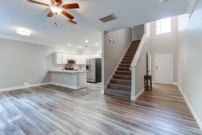Building Photo - Gated Tampa Palms Townhome with 2-Car Garage, Screened Lanai & Community Pool