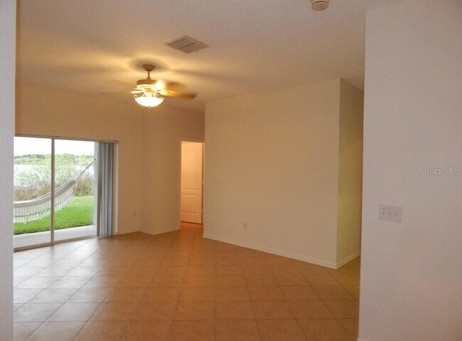 Building Photo - **Charming 4BR/2BA Pond-View Home with Boat Ramp Access – East Orlando **