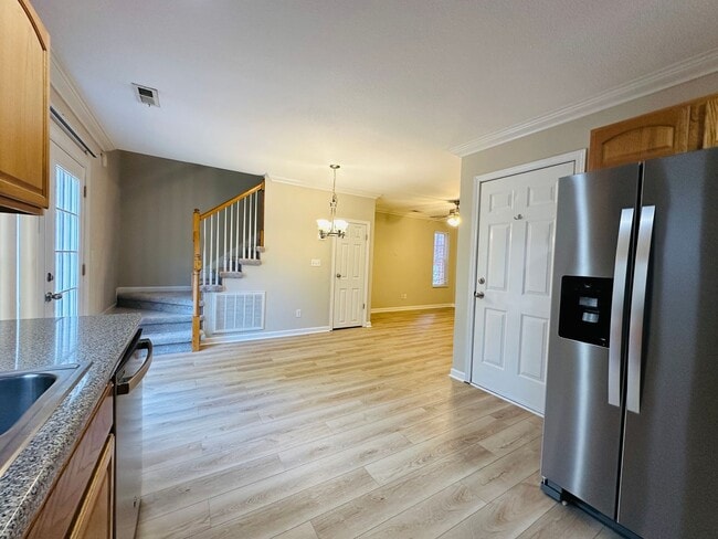 Building Photo - 2 bed, 2.5 bath updated townhouse w/ 1-car garage & Trex deck available now