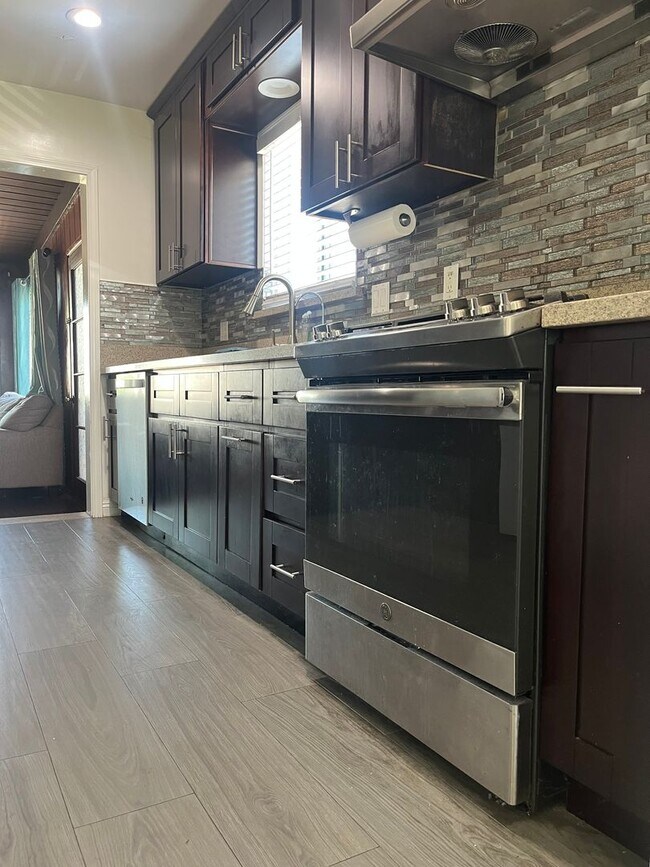 Building Photo - Home with a Cabin Style Family room and backyard Oasis