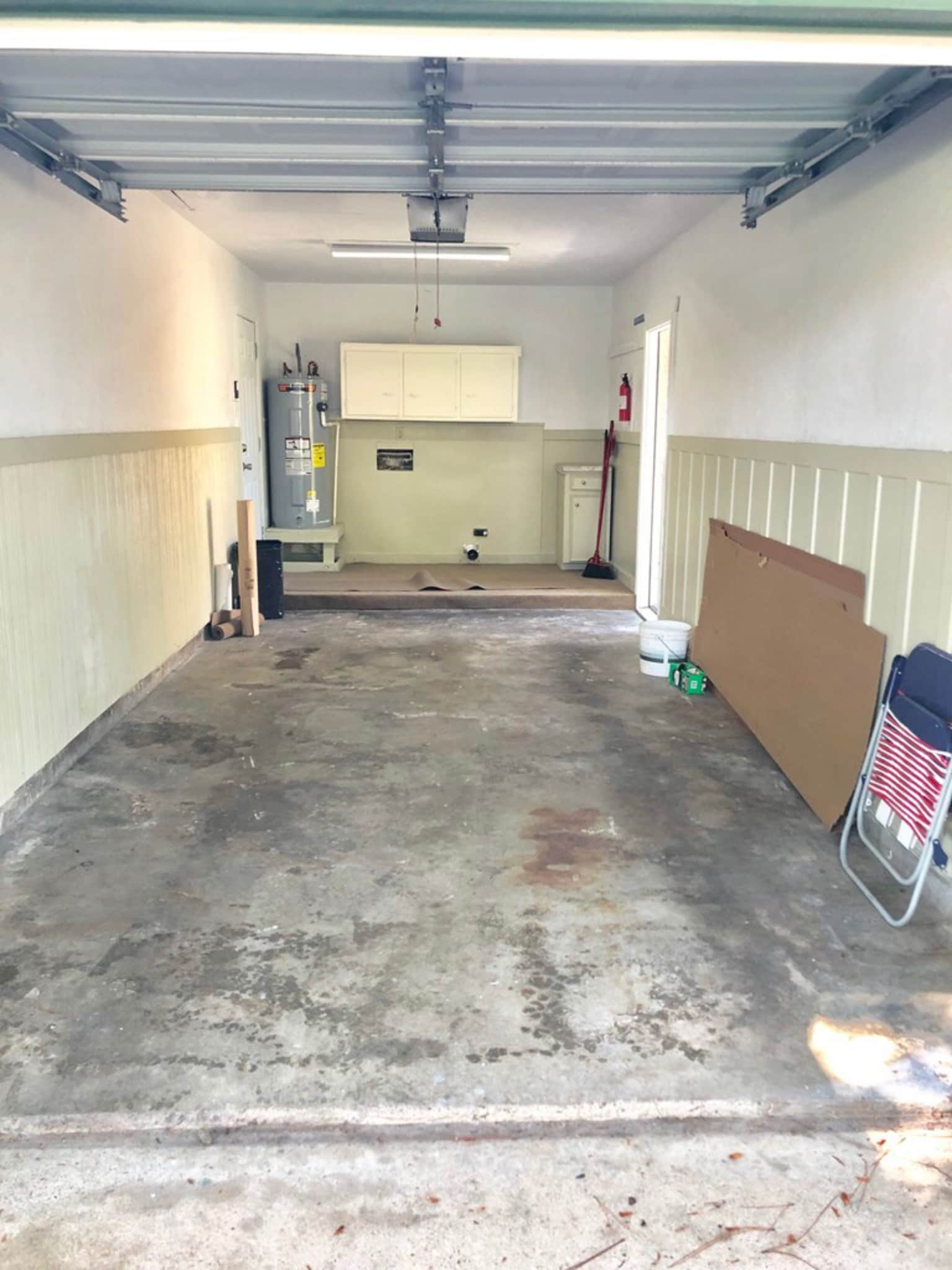 Garage with garage door opener. Utility area in garage just off of kitchen - 608 S 2nd St