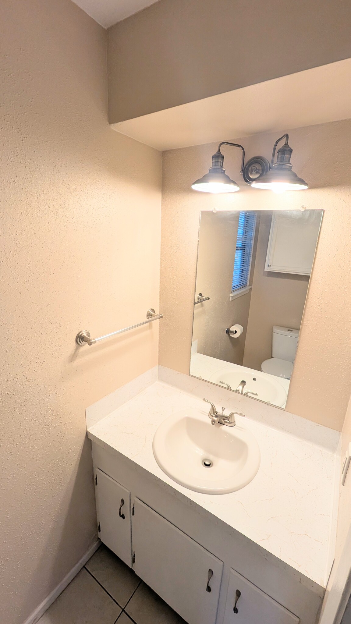 Tons of cabinet storage in this half bath. - 813 Clubside Dr