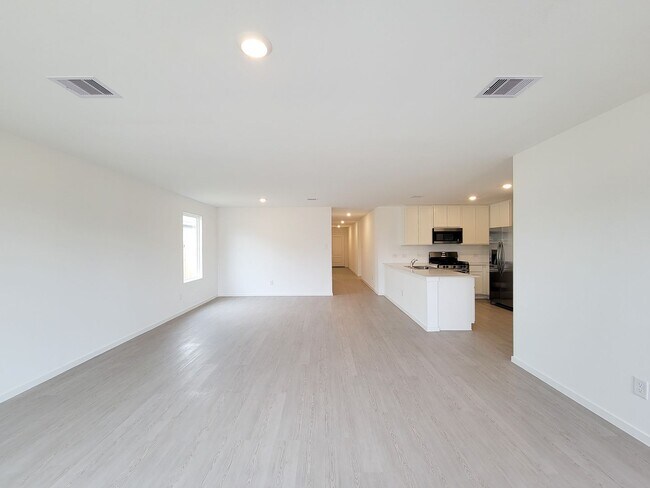 Building Photo - This great new single-story design makes smart use of the space available. At the front are all t...