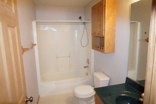 Building Photo - Rare find-3 Bedroom spacious corner unit with Den, 2.5 baths and 2 car garage