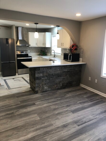 Kitchen. And living area - 1538 W New York St