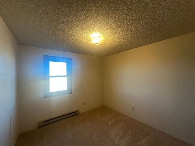 Building Photo - Two Bedroom, One and half bath townhome cl...