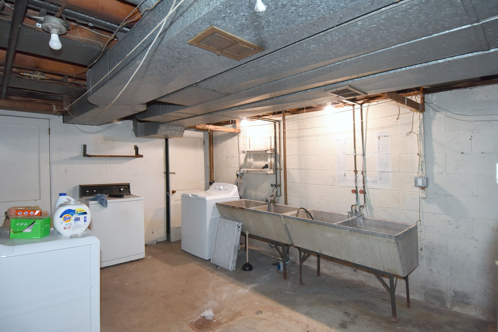 Shared laundry area has separate washer/dryer utility hookups. - 3156 Glendale Ave