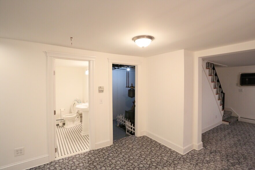 Center of first floor - kitchen to the left, half bath, systems room with washer and dryer - 51 Canal St