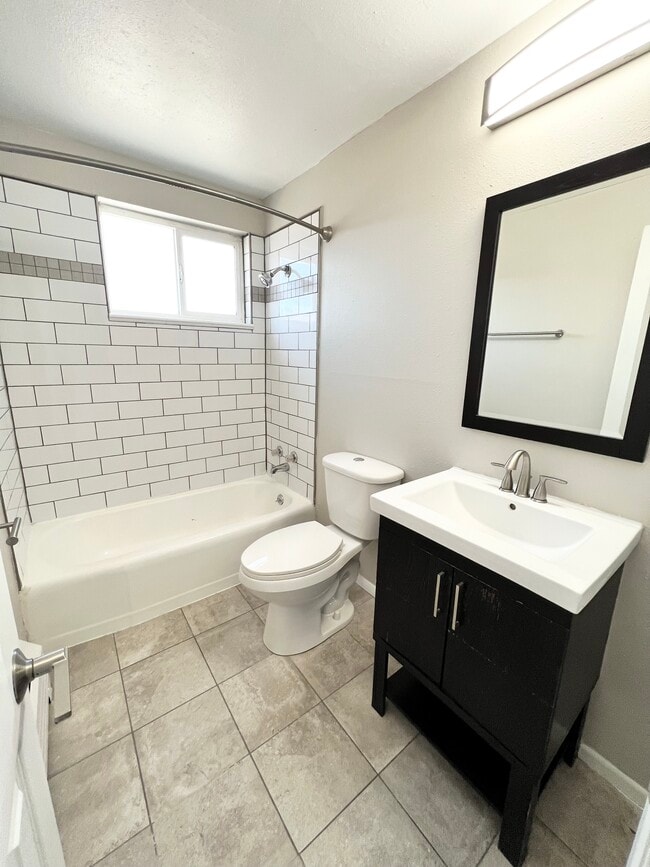 Experience modern elegance in this stylishly designed bathroom. - Wadsworth Station West