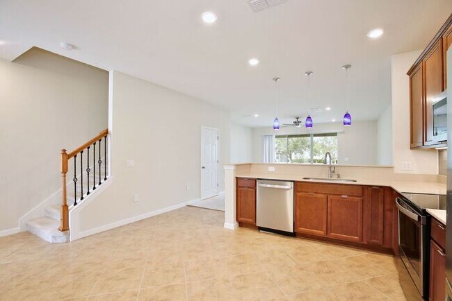 Building Photo - Immaculate Townhome · Dual En-Suite Bedrooms + Flex Loft · Cable & Internet Included · 3.5 Miles ...