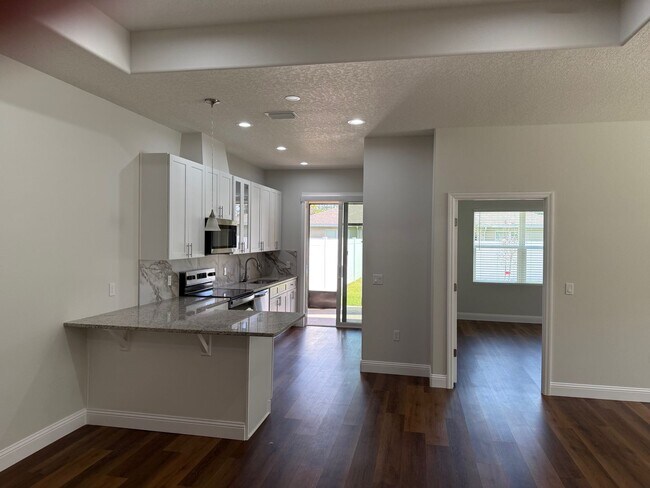 Building Photo - Brand New 3 Bedroom, 2 Bathroom Townhome with 1-Car Garage, Screened Porch & FULLY PRIVATE Fenced...