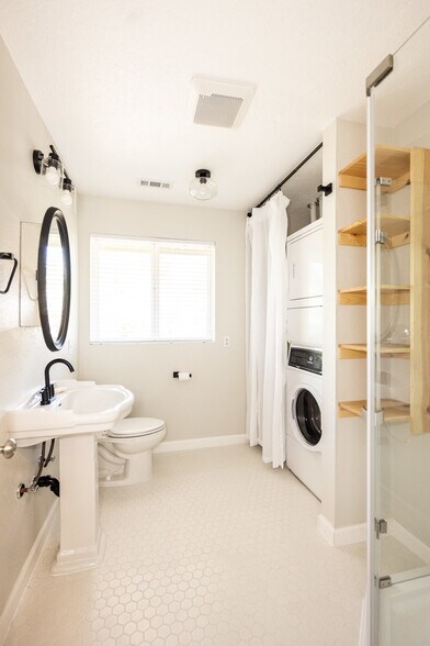 Full bath. All new fixtures (toilet, sink, shower, lights), ceramic tile floor - 8717 NE Webster St