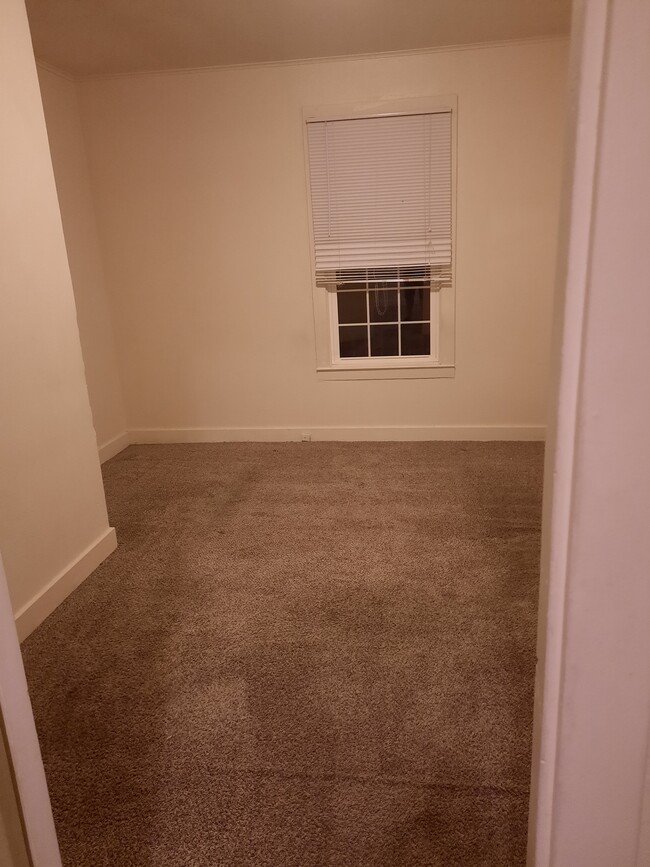 Front bedroom large double hung windows - 321 N Main St