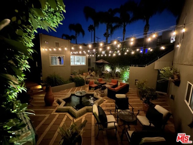 View of courtyard at night - 1217 N Curson Ave