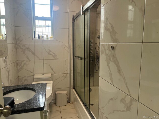 Building Photo - 208-08-208-39 39th Ave