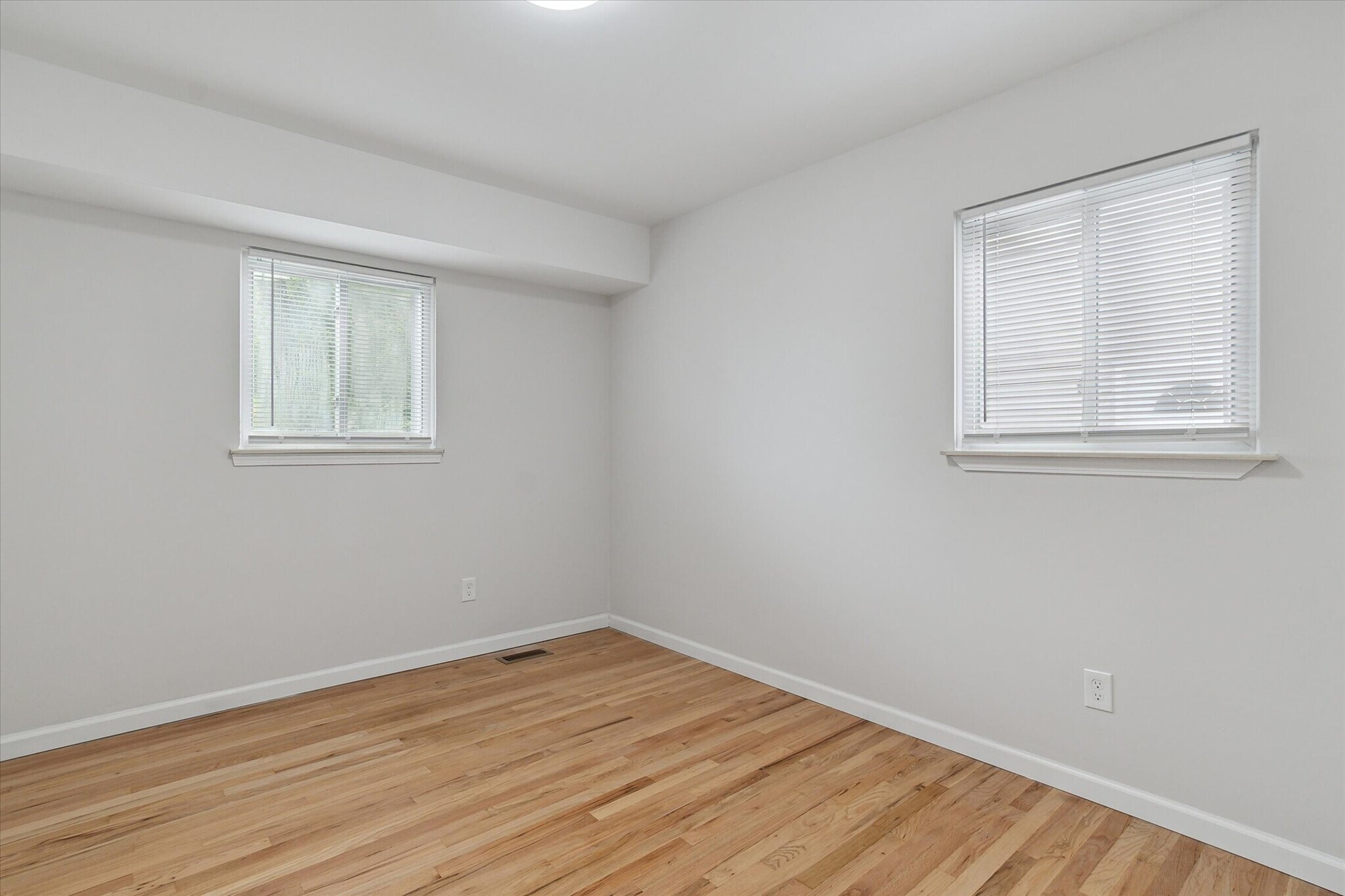 First bedroom with 2 windows in back of house. - 9244 Northern Ave