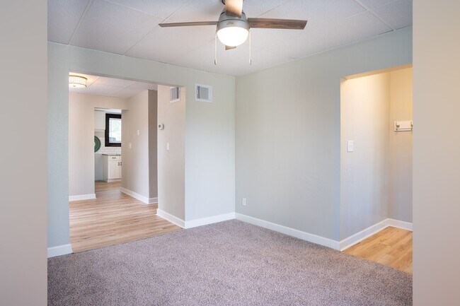 Living room looking into entry & dining room. - 222 6th Ave SE