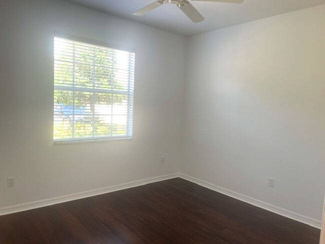 Building Photo - Elegant 3 Bedroom End-Unit Condo with Screened Lanai & Pond Views and A Private Garage