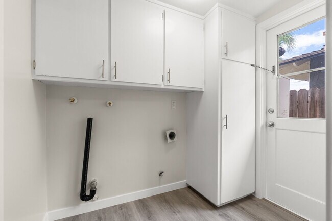 Building Photo - Charming Updated Home With Drive-Through Garage Access