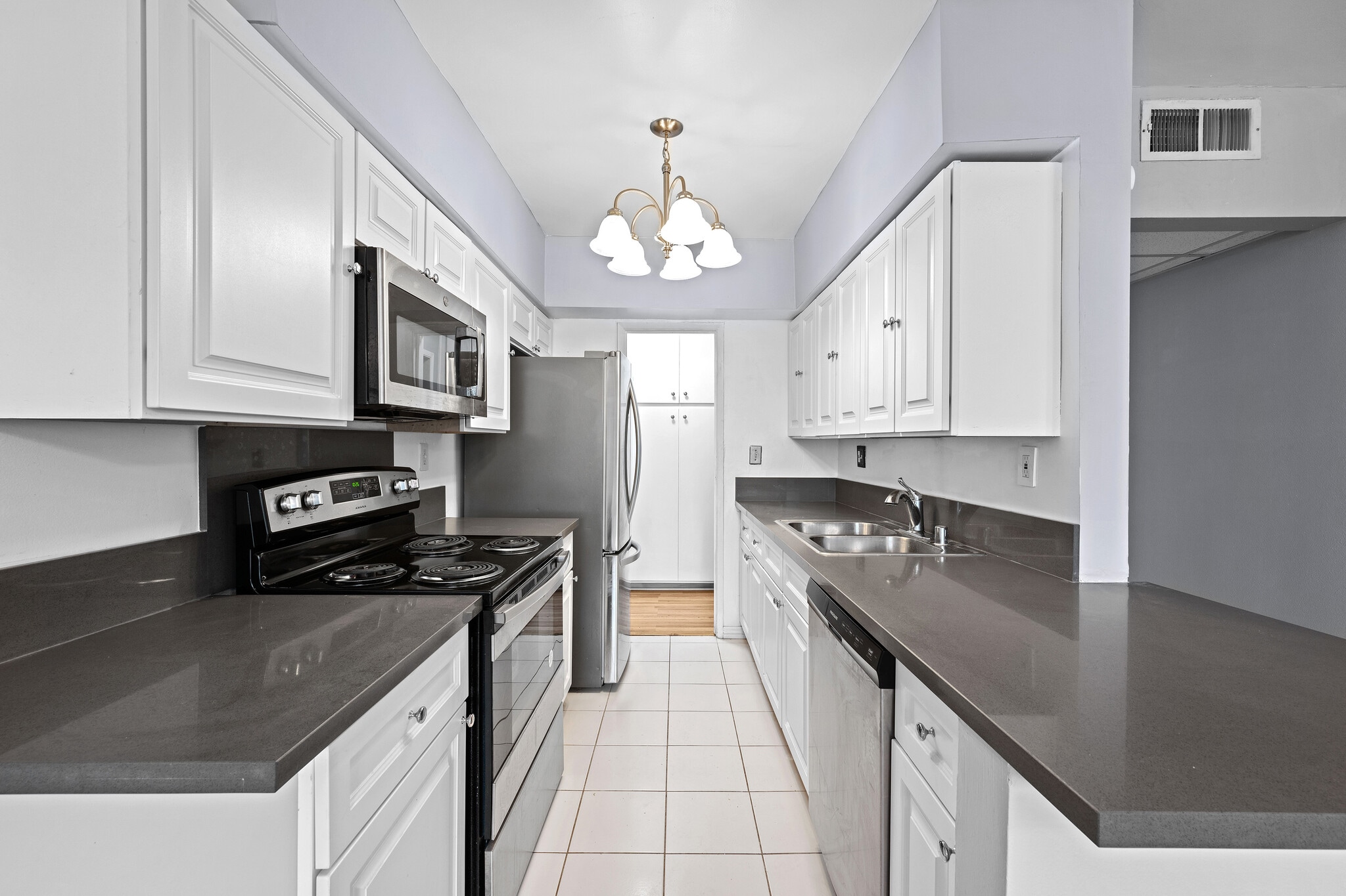Kitchen with new microwave - 12801 Moorpark St