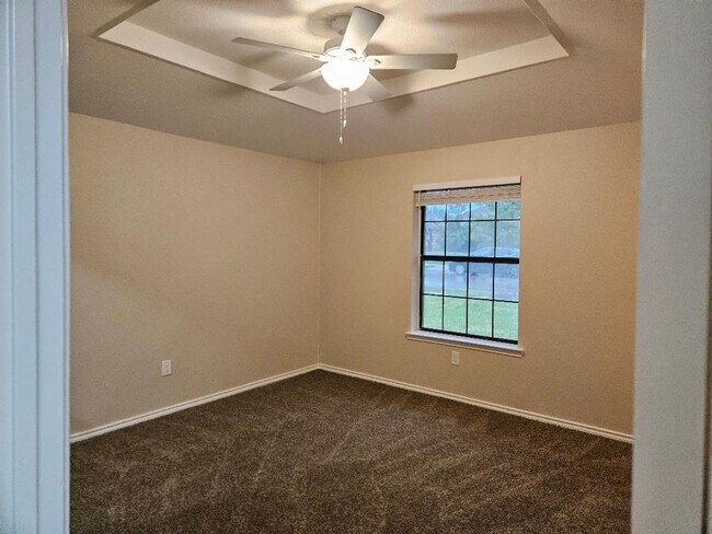 Building Photo - Three bedroom and two bathroom nicely remodeled with new flooring. Large wood fenced backyard