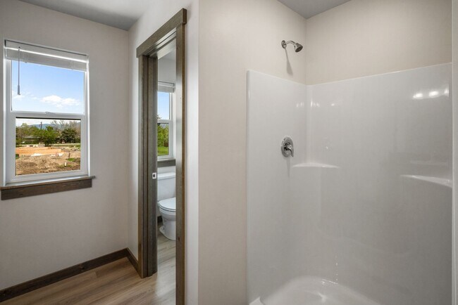 Building Photo - Pet Friendly! Gorgeous 3 Bedroom condo with double stall attached garages with AC.