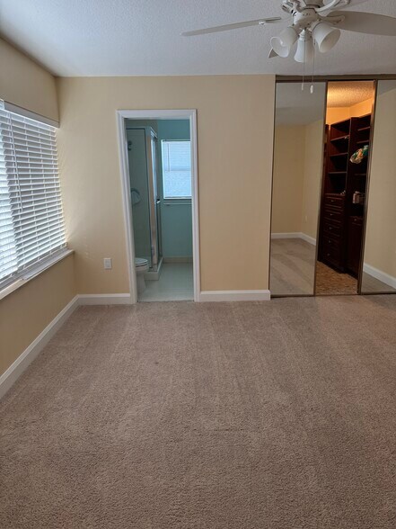 Bedroom with walk in closet and bathroom - 3441 SW Sunset Trace Cir