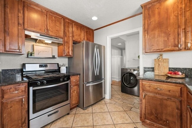Building Photo - Welcome to this stunning 4-bedroom, 2-bath...