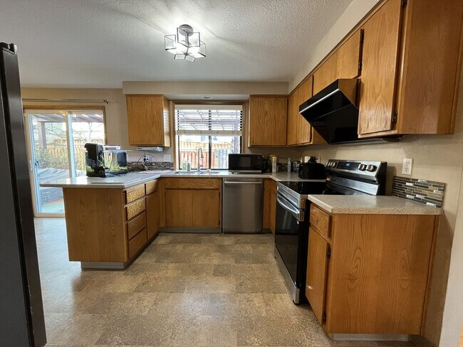 Building Photo - Light-Filled Three Bedroom Home with Private Bonus Space and Outdoor Living