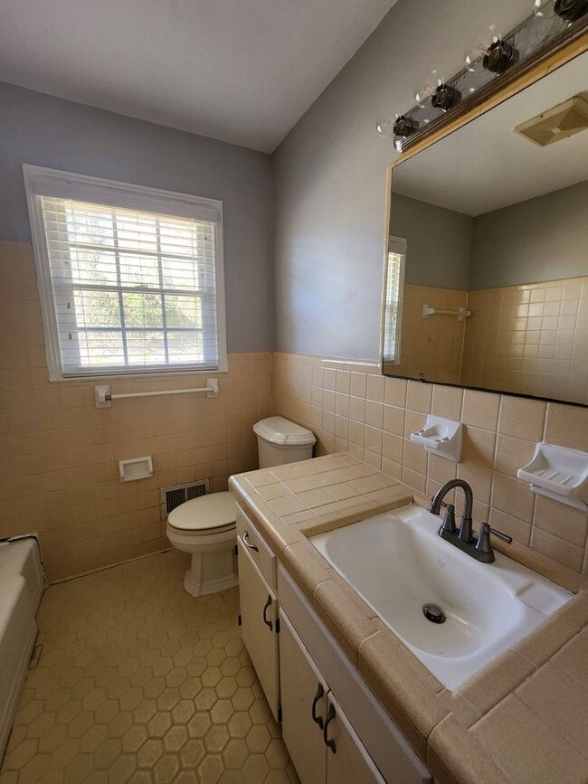 Building Photo - Spacious 3-Bedroom Brick Home with Two Living Areas & Fenced Backyard!